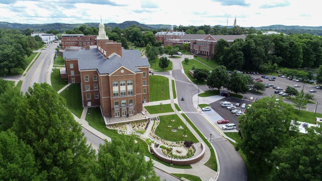 A picture of the science building or the Mac Building, aerial photo capturing the greenery of the campus.