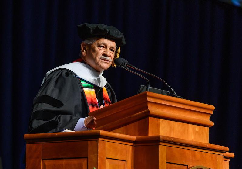 Photo of Tom Espinoza speaking at Berea College's 2023 May Commencement ceremony.