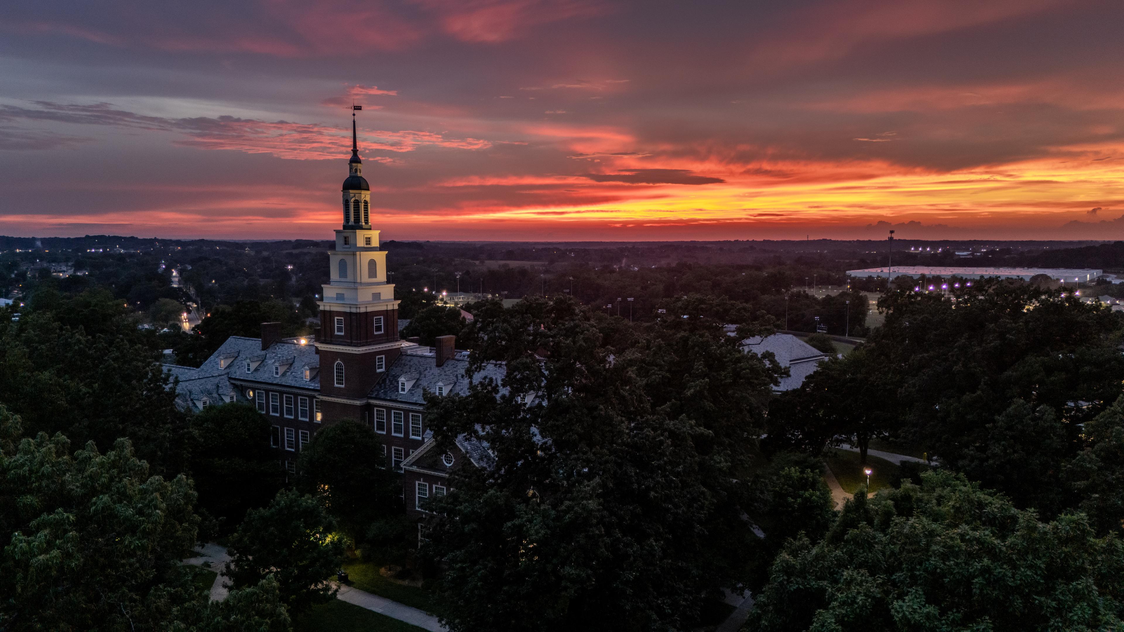Aerial view of Berea College campus at sunset, with Draper at the center.